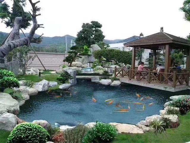 长宁庭院鱼池假山设计